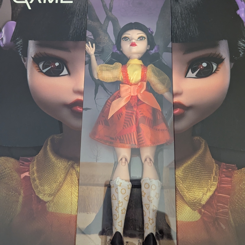 Mattel Doll with Orange Dress and Black Hair